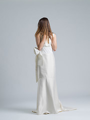 Image showing Rear view of a beautiful young woman in a wedding dress