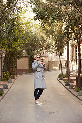 Image showing Pretty blonde taking a selfie on a spring day