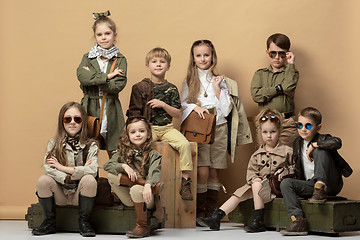 Image showing The group of beautiful girls and boys on a pastel background