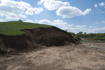 Image showing earthen ravine on top of green grass