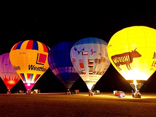 Image showing The glow of hot air balloons at night during the World Ploughing Competition in Germany 2018