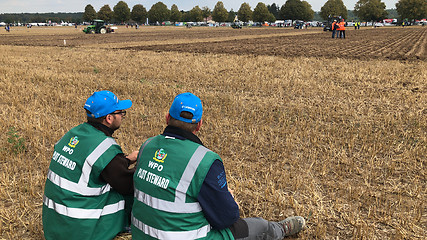 Image showing Plot Stewards waiting alongside the World Ploughing Competition in Germany 2018