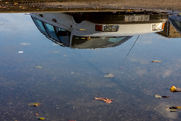 Image showing Car reflected in puddle