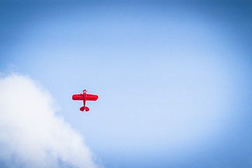 Image showing Red propeller plane flying upwards