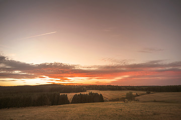 Image showing Sunset over a rural landscape with dry plains