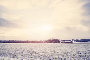 Image showing Rural winter landscape with a red barn