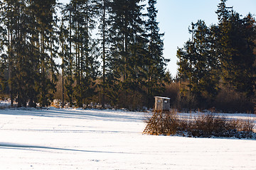 Image showing winter frozen landscape with hunting tower on highland