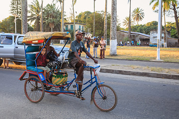 Image showing Traditional rickshaw bicycle with malagasy peoples in Toamasina,