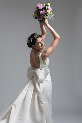 Image showing bride with a bouquet  isolated on white background