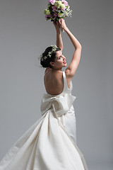 Image showing bride with a bouquet  isolated on white background