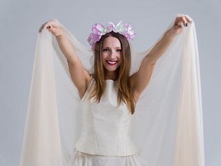 Image showing young bride in a wedding dress with a veil