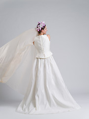 Image showing Rear view of a beautiful young woman in a wedding dress