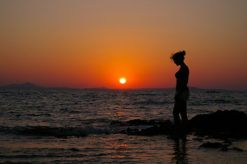 Image showing Girl in silouette and sunset