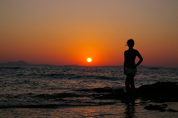 Image showing Girl in silouette and sunset