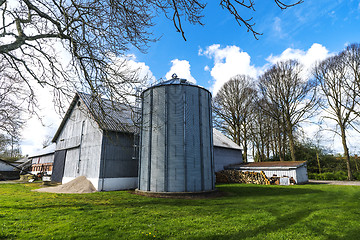 Image showing Small farm with a large silo