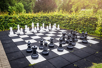 Image showing Large outdoor chess game on a garden terrace