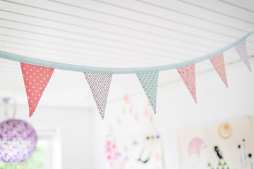 Image showing Colorful birthday flags in kids playroom