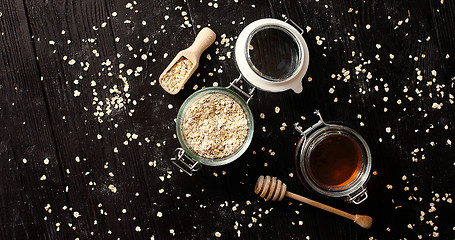 Image showing Oat in glass jar with honey