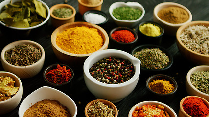 Image showing Many bowls with different spices