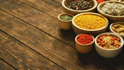 Image showing Arrangement of spices in small bowls