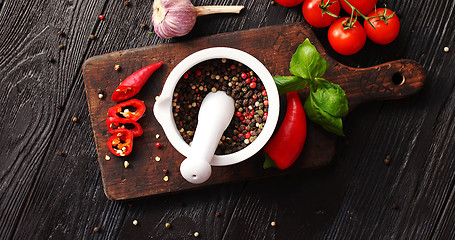 Image showing Bowl with spices on chopping board