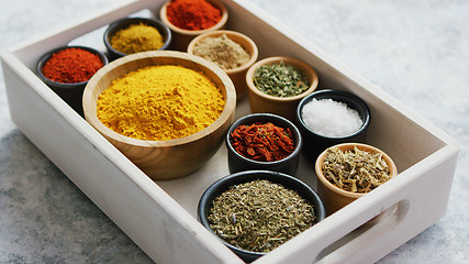 Image showing Wooden box with assortment of spices