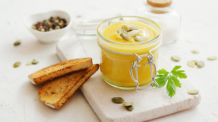 Image showing Pumpkin soup in glass jar with bread