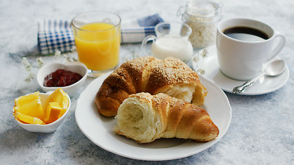 Image showing Served breakfast with drinks and croissant