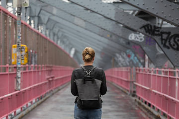 Image showing Solo casual woman walking the cycling lane on Williamsburg Bridge, Brooklyn, New York City, USA