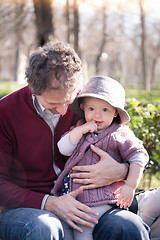 Image showing Father with cheerful child in the park.