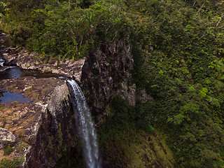 Image showing Aerial top view perspective of amazing 500 feet tall waterfall in the tropical island jungle of Mauritius.