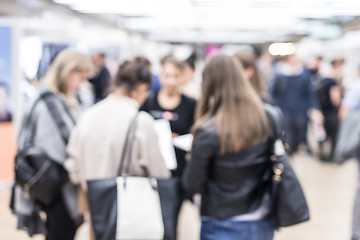 Image showing Blured image of businesspeople networking and socializing during coffee break at business event.