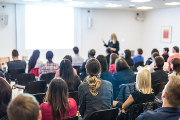 Image showing Woman giving presentation on business conference workshop.