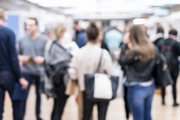 Image showing Blured image of businesspeople networking and socializing during coffee break at business event.