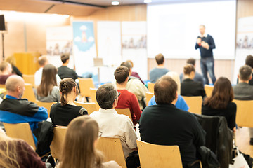 Image showing Business speaker giving a talk at business conference event.