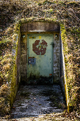 Image showing Rusty door with a lock on a bunker