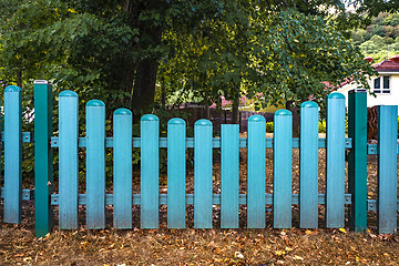 Image showing Blue fence gate  at a yard in the fall