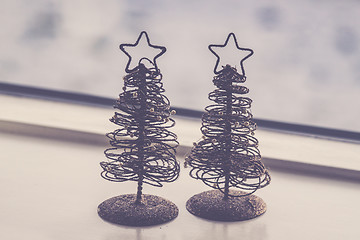 Image showing Two small decorative Christmas trees