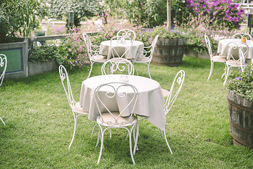 Image showing Romantic garden setting with vintage furniture