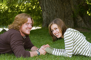 Image showing Young couple holding hands in the Park