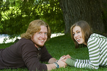 Image showing Young couple holding hands in the Park