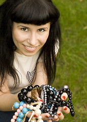 Image showing young brunette with beads