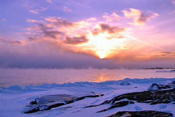 Image showing Sunset and cold fog spreads over freezing northern sea