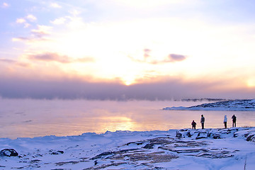 Image showing Sunset and cold fog spreads over freezing northern sea