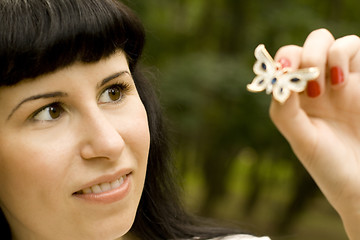 Image showing pretty young brunette with brooch