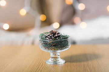 Image showing christmas fir decoration with cone in dessert bowl