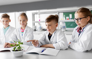 Image showing kids or students with plant at biology class