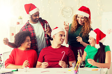 Image showing happy team celebrating christmas at office party