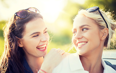 Image showing happy women or teenage girls laughing outdoors