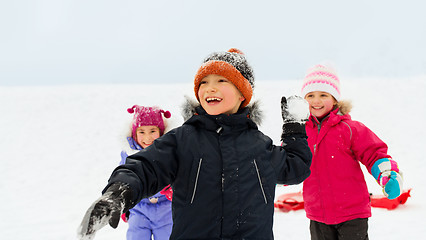 Image showing happy little kids playing outdoors in winter